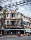 Bangkok, Thailand, Southeast Asia - Lots of electricity cables in the sky. wo people riding motorbike.