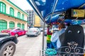 BANGKOK, THAILAND - 1.11.2019: View from the tuk tuk taxi car in Bangkok city. Thai driver in foreground. TukTuk is famous