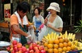 Bangkok, Thailand: Woman Biying Fruit