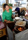 Bangkok, Thailand: Woman Cooking Flat Bread