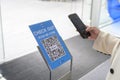 Bangkok ; Thailand: 20/10/2021 - Woman`s hand is holding smartphone for checking News about COVID-19 prevention in shopping cente