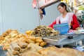 Bangkok, Thailand: Woman selling food