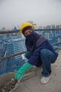 Bangkok, Thailand, women workers on the top of a building site Royalty Free Stock Photo