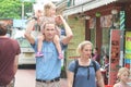 BANGKOK, THAILANDS - April 29 ,2018 : Dad carry daughter on his neck while walking with his wife on Khao San road ,Bangkok Thailan Royalty Free Stock Photo