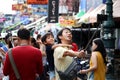 BANGKOK, THAILANS- JUNE 3 2018 : Father carrying his son on back taking picture by smartphone on selfie stick and hiking at Khao S Royalty Free Stock Photo