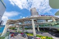 Bangkok traffic road with colorful taxi and BTS skyrail way public transport in popular travel city