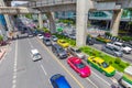 Bangkok traffic road with colorful taxi and BTS skyrail way public transport in popular travel city