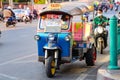 Bangkok Tuk-tuk taxi tricycle stands on the side of the road. Royalty Free Stock Photo