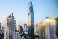 Bangkok twilight cityscape of Mahanakorn tower with sun light