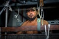 Portrait of a yarn factory worker operating a yarn machine at Narsingdi Bangladesh