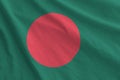 Bangladesh flag depicted on folded wavy fabric of old cloth