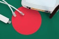 Bangladesh Flag Depicted On Table With Internet Rj45 Cable, Wireless Usb Wifi Adapter And Router. Internet Connection Concept