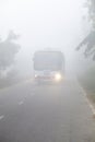 Bangladesh Ã¢â¬â January 06, 2014: On a foggy winter morning, a bus is passing through the foggy streets and slows traffic at