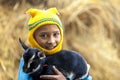 Bangladesh Ã¢â¬â January 06, 2014: a little kids are holding a yeanling at Ranisankail, Thakurgaon