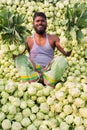 A worker is showing best fresh turnips at Savar, Dhaka, Bangladesh