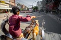 Life under coronavirus lockdown in bangladesh. In the empty city, a horse-drawn carriage is running