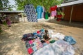 Bangladesh - May 19, 2019: A Rural village Businessman selling cloth and products to hang up on the tree trunk, Meherpur,