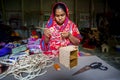 A young crafts maker is making a showpiece from the fibers of a banana tree at Madhupur, Tangail