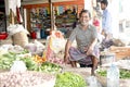 He is very happy that a shopkeeper is sitting in the vegetable shop