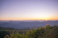 BANGLADESHI BEAUTIFUL MOUNTAIN.FOREGROUND THE GREEN GRASSES THEN MOUNTAIN LAIR IN THE MIDDLE WITH BEAUTIFUL SUNRISE