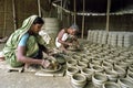 Bangladeshi female potters in interior of pottery