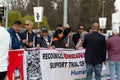 Bangladeshi people protesting at the Broken Chair monumental sculpture in front of the UN office in Geneva, Switzerland