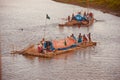 People travelling on a traditional boat in the river unique photo