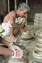 Bangladeshi senior potter at work in pottery