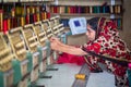 Bangladesh Ã¢â¬â August 6, 2019: A Bangladeshi woman garments worker working with Computerized Embroidery Machine at Madhabdi,