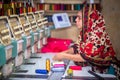 Bangladesh Ã¢â¬â August 6, 2019: A Bangladeshi woman garments worker working with Computerized Embroidery Machine at Madhabdi,