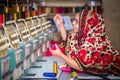 Bangladesh Ã¢â¬â August 6, 2019: A Bangladeshi woman garments worker working with Computerized Embroidery Machine at Madhabdi,