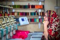 Bangladesh Ã¢â¬â August 6, 2019: A Bangladeshi woman garments worker working with Computerized Embroidery Machine at Madhabdi,