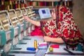 Bangladesh Ã¢â¬â August 6, 2019: A Bangladeshi woman garments worker working with Computerized Embroidery Machine at Madhabdi,