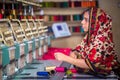 Bangladesh Ã¢â¬â August 6, 2019: A Bangladeshi woman garments worker working with Computerized Embroidery Machine at Madhabdi,