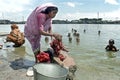 Bangladeshi woman washing clothes in lake Royalty Free Stock Photo