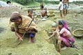 Bangladeshi women working with kids in gravel pit Royalty Free Stock Photo