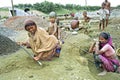 Bangladeshi women working with kids in gravel pit Royalty Free Stock Photo