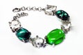 Silver bangle with brilliants and green stones Royalty Free Stock Photo