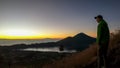 Bangli - A man enjoying sunrise on Mt Batur