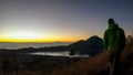 Bangli - A man enjoying sunrise on Mt Batur