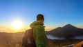 Bangli - A man enjoying sunrise on Mt Batur