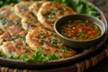 Banh xeo with lettuce and Nuoc Cham dipping sauce