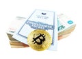 Bank book of Sberbank, stack of rubles and bitcoin coin