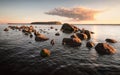 Bank with boulders and stones on sunset. Baltic sea, gulf of Finland Royalty Free Stock Photo