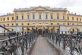 Bank bridge in St. Petersburg, Russia. The inscription on the building in Russian: St. Petersburg State University of Economics Royalty Free Stock Photo