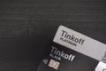 Bank cards, Tinkoff black and Tinkoff platinum on a wooden background Royalty Free Stock Photo
