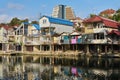 The bank of the Dagomys river is built up with small cottages with garages for boats in Sochy, Russia