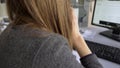 Bank employee calling clients to remind them about term of loan repayment