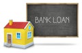 Bank loan text on blackboard with 3d house