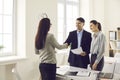 Bank manager, loan broker or real estate agent shaking hands with happy young couple Royalty Free Stock Photo